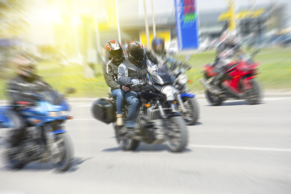 Fast moving bikers in motion blur